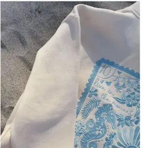 Women casual solid color embroidered long sleeve hooded sweatshirt with unique aesthetic design.
