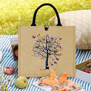 Durable jute tote bag with a chic butterfly tree pattern, ideal for travel and picnics.