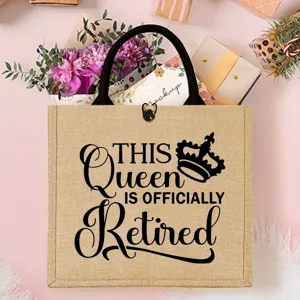 Detailed view of the burlap tote bag with retirement queen quote print and sturdy black handle.