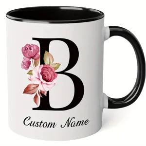 Personalized letter B ceramic coffee mug with watercolor floral design and black handle rim.