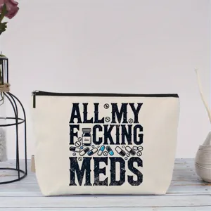 Detailansicht der Canvas Kosmetiktasche mit Tabletten Print und schwarzem Reissverschluss.