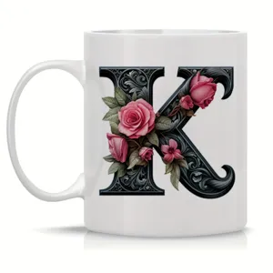 White ceramic coffee mug with elegant black floral letter K monogram, perfect for office use.