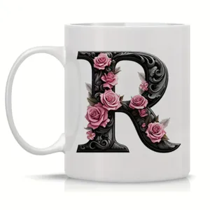White ceramic coffee mug with ornate floral letter R design, perfect for office and daily use.