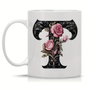 Ceramic coffee mug featuring elegant gothic letter T and pink roses for office and home use detail.