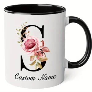 Custom floral letter S ceramic coffee mug with black handle, personalized office drinkware.