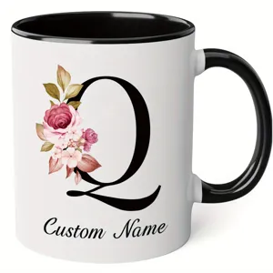 Custom letter Q ceramic mug with floral design, black handle, perfect for coffee and office use.