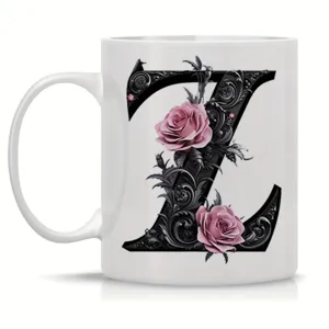Detailed view of the ceramic mug featuring an ornate black floral letter Z and pink roses.