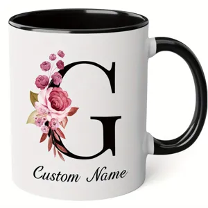 Custom letter G ceramic coffee mug with watercolor floral design and personalized name text.