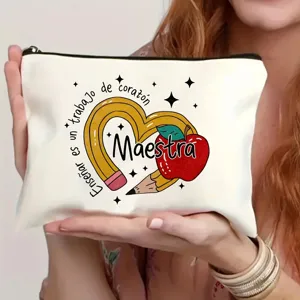 Detailed view of a white canvas cosmetic bag with teacher theme print and secure zipper closure.