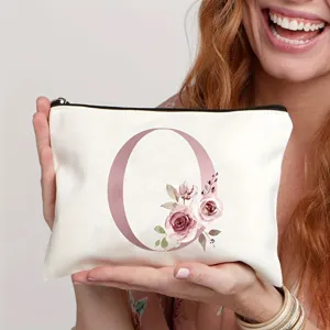 Leinwand Kosmetiktasche mit pinkem Buchstabe O und Blumenmuster Detail, sicherer Reißverschluss.