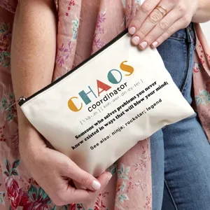 Canvas makeup pouch detail showing funny coordinator quote print and smooth zipper closure.
