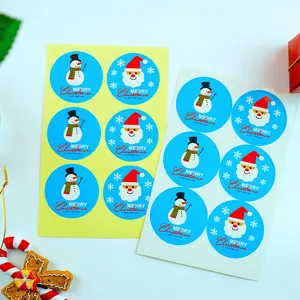 Christmas sticker set blue background Santa snowman baking sealing labels decoration detail view.