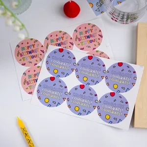 Close-up of colorful round birthday and congratulations stickers, creative design.