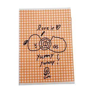 Orange gingham greaseproof paper bag with cute cartoon doodles, perfect for bakery and gifts.