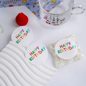 Detail view of colorful Happy Birthday sealing stickers, perfect for gift packaging and party decor.