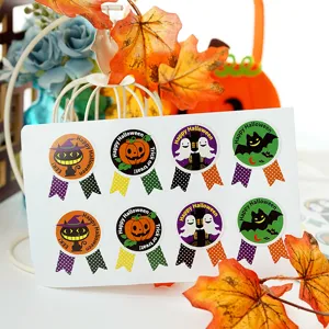 Detail view of Halloween stickers featuring cute ghosts, bats, and pumpkin designs.