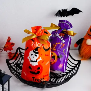 Halloween candy gift bags with cute pumpkin and ghost print, perfect for party favors.