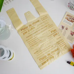 Plastic vest shopping bag with French letter print, ideal for retail and gift packaging use.