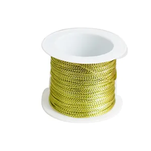 Gold metallic thread spool for DIY crafts, gift packaging and decorative hanging ropes.