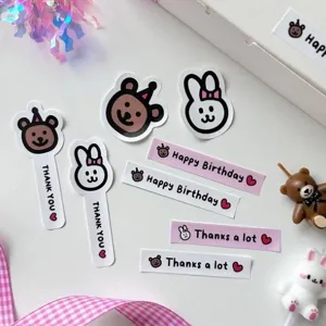Cute pink white cartoon sticker set with thank you and happy birthday text for decoration.