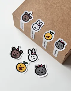 Close-up view of cute cartoon animal stickers featuring bear, rabbit and cat designs.