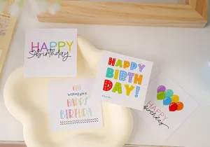 Mini birthday greeting cards set, cute colorful balloon designs with writing space for cake decor.