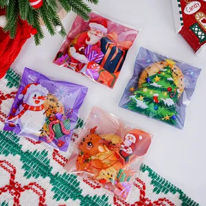 Christmas cartoon cookie packaging bags detail view, featuring cute Santa and snowman designs.