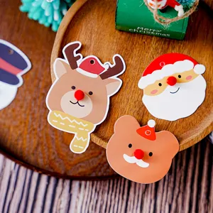 Cute Christmas paper tags set with Santa and reindeer for holiday baking decoration gifts.
