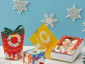 Scatola regalo di carta a forma di libro di Natale, confezione DIY creativa per biscotti e feste.