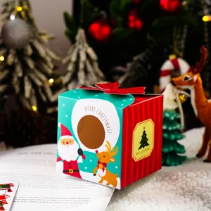 Detalle de caja de embalaje de manzana de Navidad, lindo diseño de Papá Noel y reno, caja de regalo.