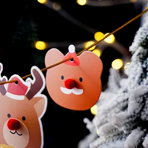 Christmas decorative paper tags close up, cute bear and reindeer design, holiday hanging cards.
