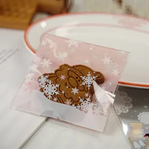 Sacchetto regalo autoadesivo con fiocco di neve, ideale per caramelle e piccoli gioielli.
