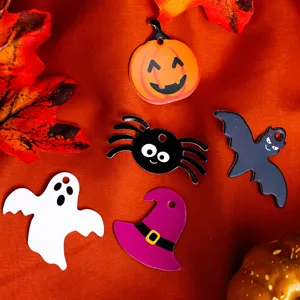 Halloween themed DIY charms detail showing cute pumpkin spider ghost bat hat shapes.