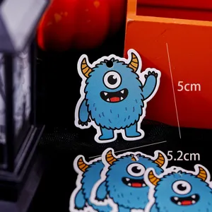 Cute blue one-eyed monster paper tags for DIY crafts and Halloween party decorations.