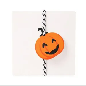 Halloween pumpkin shape decorative hang tag bookmark with black white twine rope DIY craft.