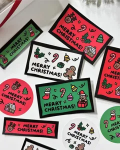 Detailed view of colorful Christmas greeting cards and stickers featuring festive holiday designs.