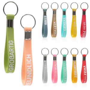 Portachiavi in silicone colorato con testi motivazionali tedeschi, regali e accessori ideali utili.