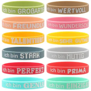 Braccialetti in silicone colorati con testi motivazionali per studenti e regali di festa.