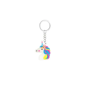 Detailed close-up shot of the luminous unicorn keychain with metal ring and colorful mane.