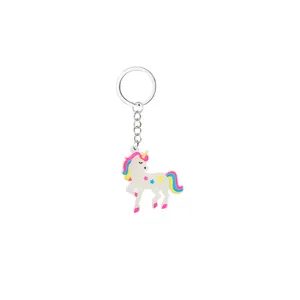 Close-up detail of the cute luminous unicorn keychain pendant with colorful stars.
