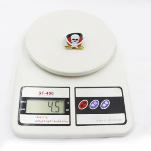 Detailed shot of a pirate skull silicone ring, weighing 4.5g on a scale for kids party toy.