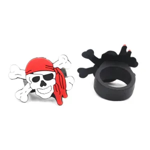 Detail view of PVC silicone pirate skull ring with red bandana for kids party toy gifts.