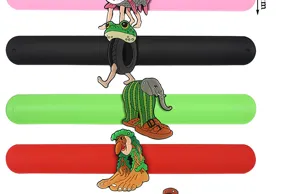 Colorful PVC slap bracelets with quirky abstract cartoon pendants, creative fun gifts.