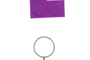 Purple silicone building block keychain cute PVC toy pendant accessory for keys and bags.
