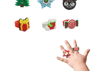 Close-up view of cute Christmas silicone rings featuring various holiday designs for kids.