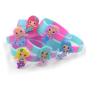 Colorful silicone wristband featuring cute cartoon mermaid charms, perfect kids accessory.