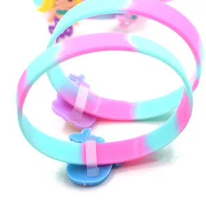 Colorful silicone bracelet with cute cartoon charm, vibrant gradient design for kids and sports.