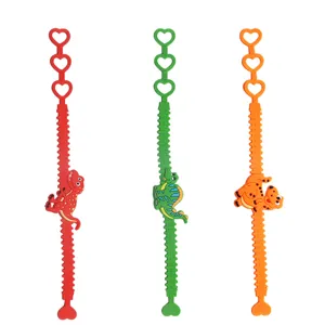 Niedliches Cartoon Dinosaurier Silikon Armband für Kinder mit herzförmigen verstellbaren Löchern.