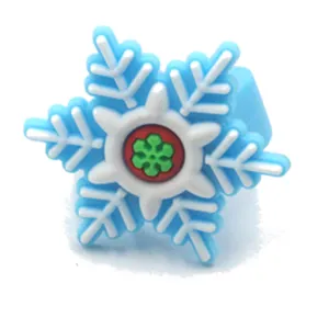 Detailed closeup of children soft rubber snowflake ring, cute Christmas festival toy jewelry.