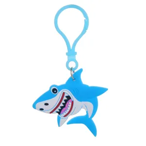 Detailed close-up of a cute blue cartoon shark PVC keychain and bag charm accessory.
